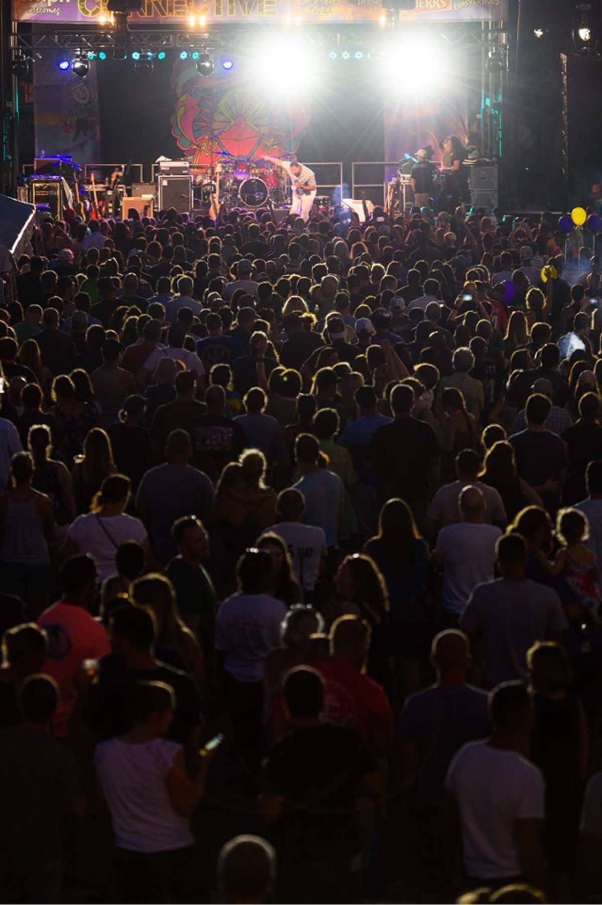 Moe on the main stage before a massive nighttime festival crowd