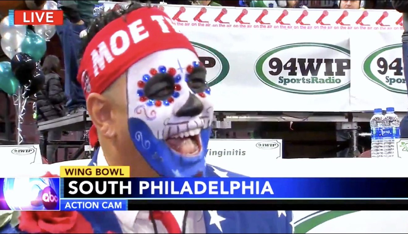 Moe in sugar skull face paint and a red Moe Train headband at Wing Bowl, live on ABC's Action Cam