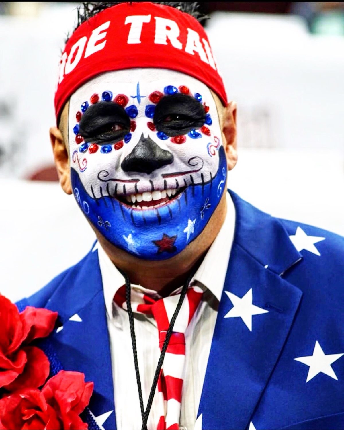 Close-up of Moe's red, white, and blue sugar skull face paint with a Moe Train headband