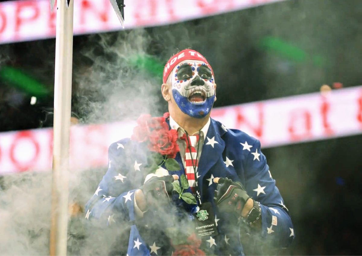 Moe in a star-spangled suit and sugar skull paint making his Wing Bowl entrance through smoke