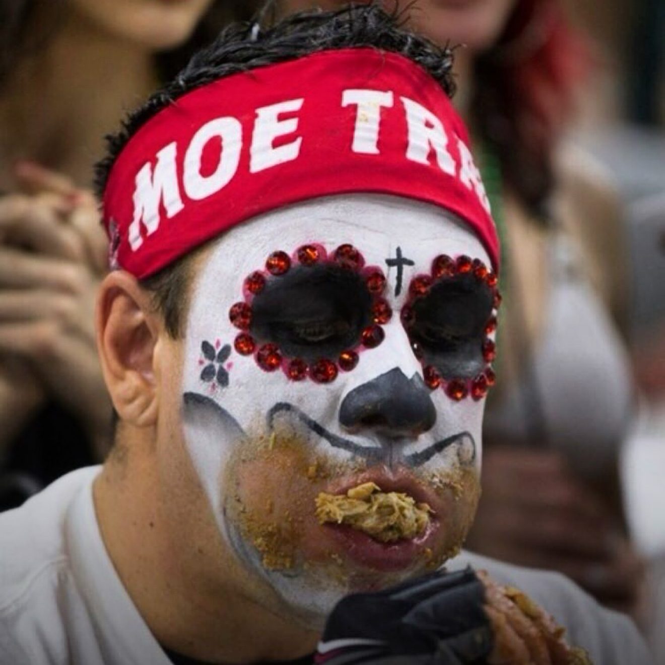 Moe eating wings mid-competition at Wing Bowl